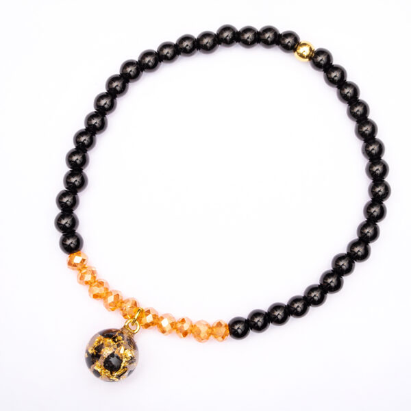 Bransoletka z obsydianem i nasionami dmuchawca zatopionymi w żywicy